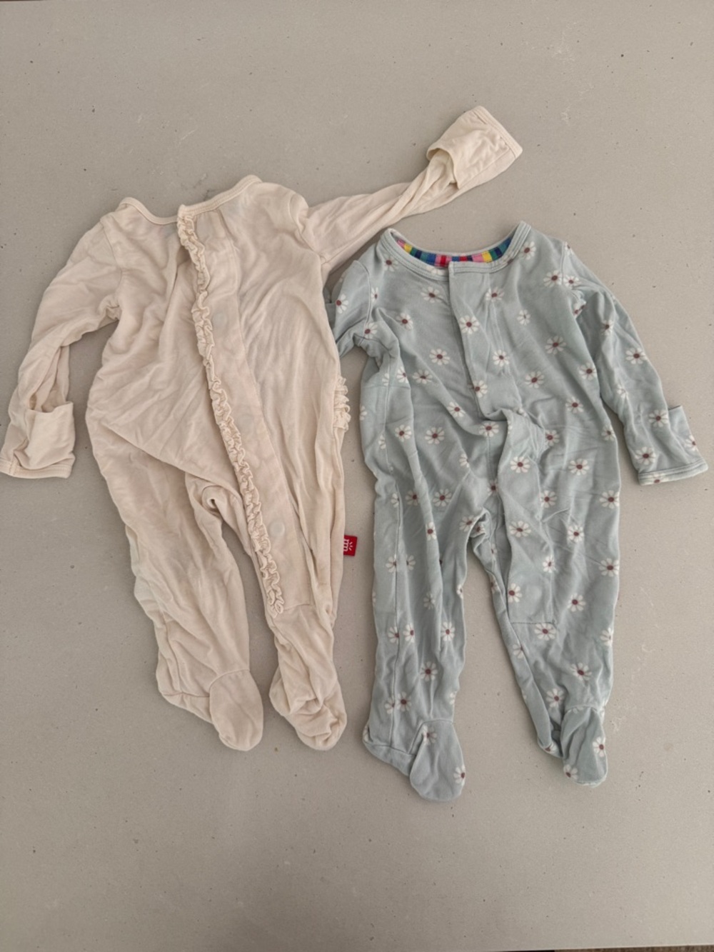 Two Magnetic Me modal onesies